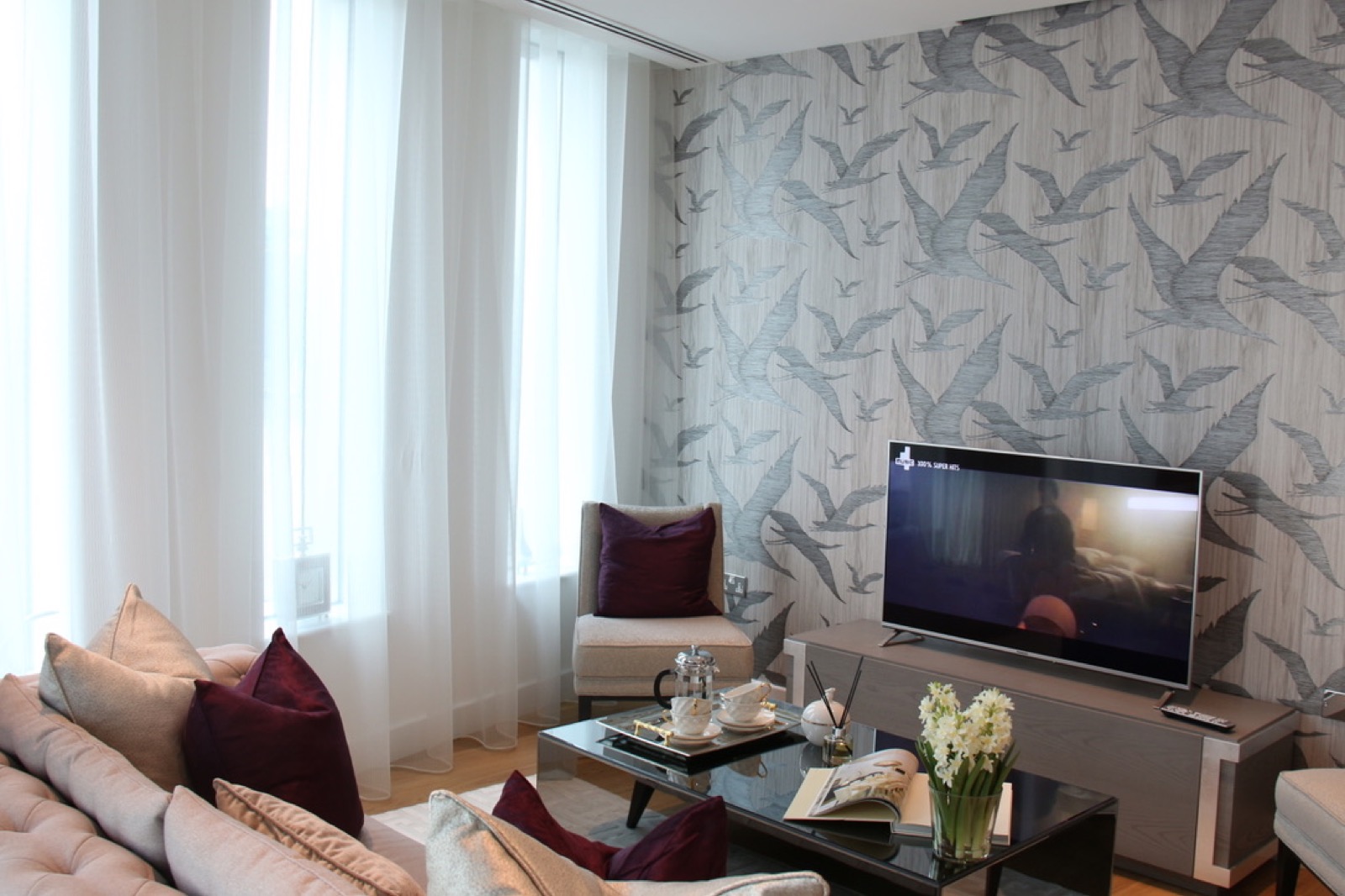 Living room with feature bird wallpaper